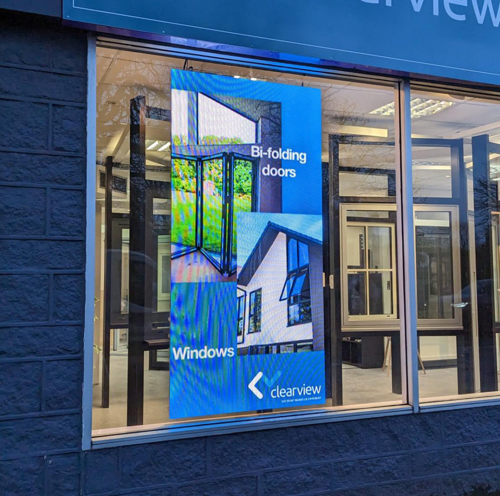 A 2m by 1m LED screen situated in the window of Clearview bi-folding doors